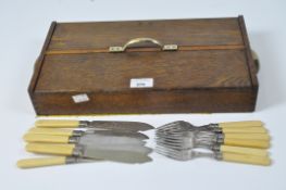 A set of six silver mounted EPNS forks and fish knives,