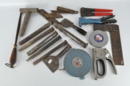 A selection of vintage tools, including chisels,