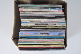 A collection of primarily 1980's vinyl albums, including Soft Cell, Bruce Springsteen,