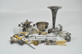 A collection of silver plate and metalware, including a large EPNS vase with pierced details,