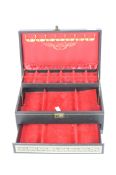 A large hinged jewellery box with three red lined compartments and hooks, 13cm x 32cm x 20.