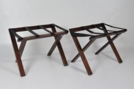 A pair of folding stained wood luggage rests, height 60cm,