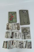 Three early 20th century postcard albums, together with with a collection of loose postcards,