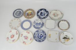 A large variety of dinner plates, including two pieces by Royal Doulton,