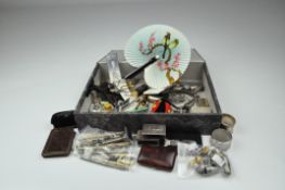 An assortment of metalware, including thimbles, sewing related items,