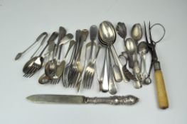 An assortment of silver plated flatware, including forks,