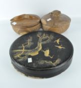 A Japanese black lacquer circular box, decorated with cranes between pine tree branches,