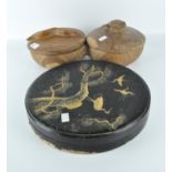 A Japanese black lacquer circular box, decorated with cranes between pine tree branches,