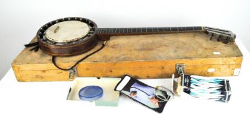 A vintage Windsor no 2 banjo, in wooden case, 96cm long; together with two acoustic guitars
