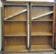 Two contemporary large oak open bookcases, each with two fitted and three adjustable shelves,