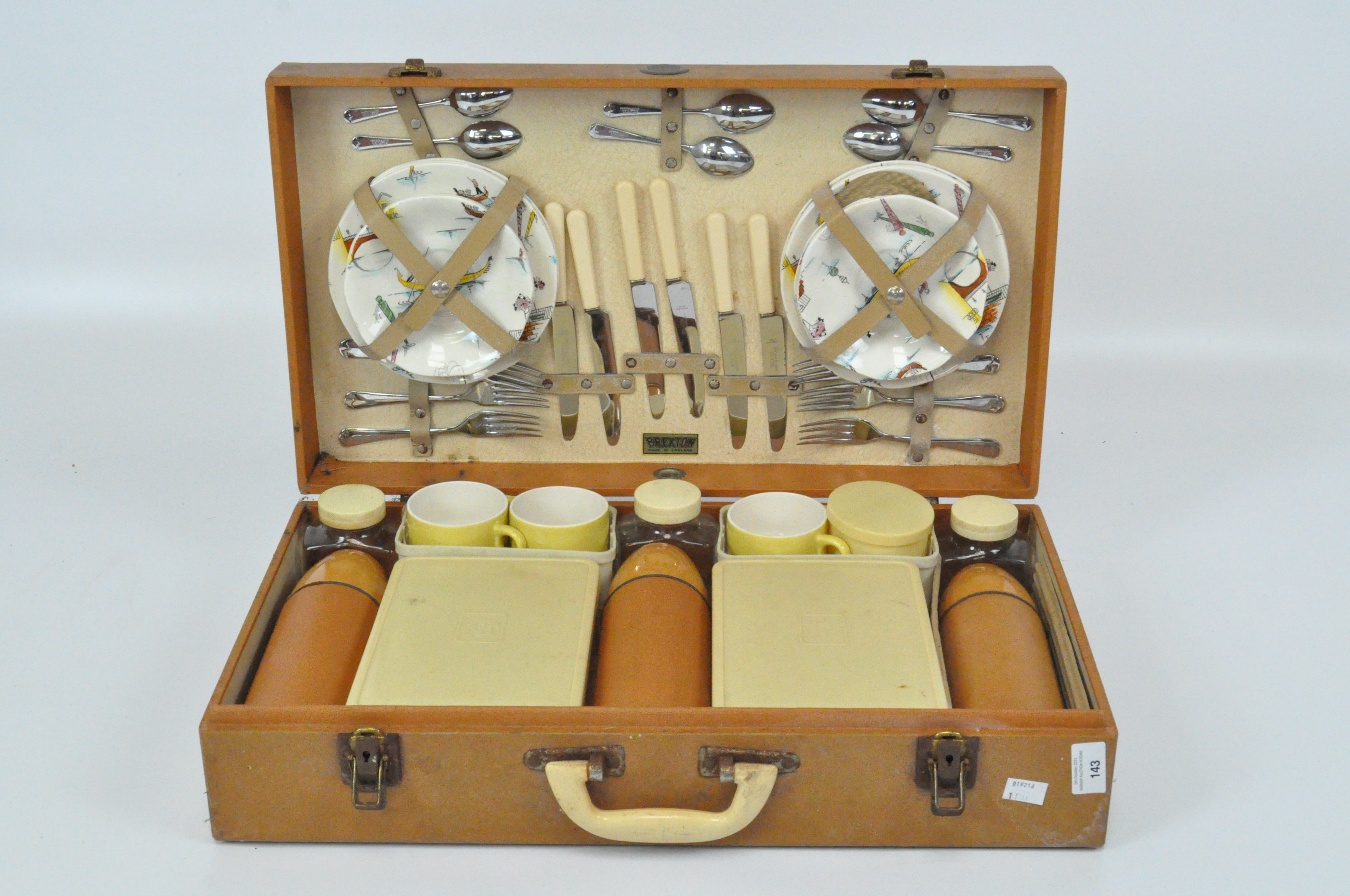 A vintage "Brexton" picnic hamper with original contents, previous owners name to front "J H Todd" ,