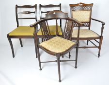 Two Edwardian dark stained dining chairs with yellow-green upholstery,