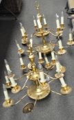 A pair of Louis XVI-style, gilt-metal, two-tier, fourteen-light chandelier,