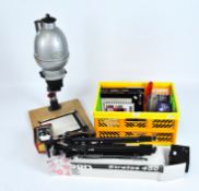 A group of photography equipment, including cameras, dark room accessories,enlarger and books,
