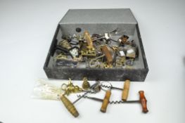 A selection of small metal wares, including corkscrews,