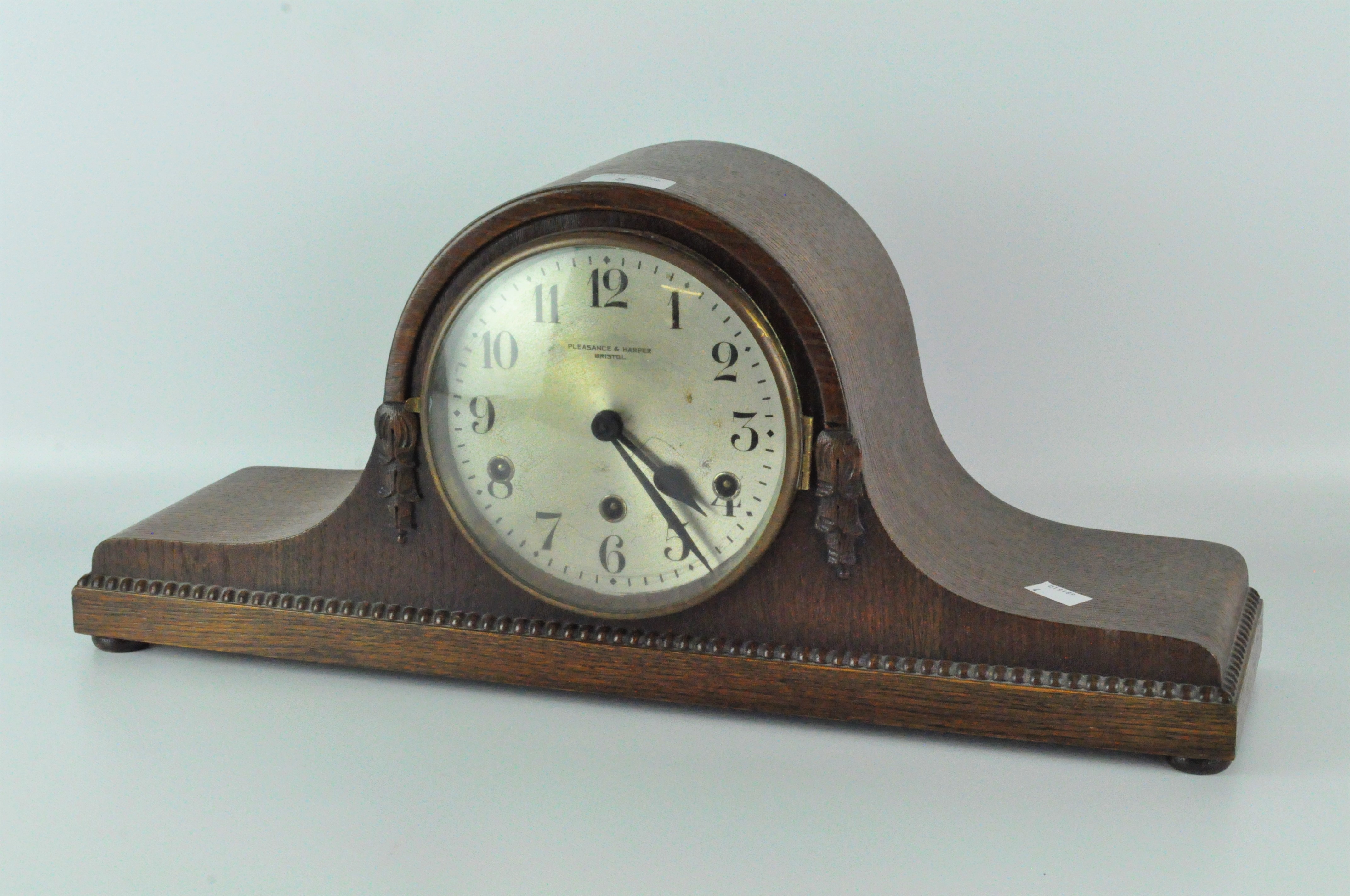 An early 20th century mantel clock, silvered dial with Arabic numerals, signed 'Pleasance & Harper,