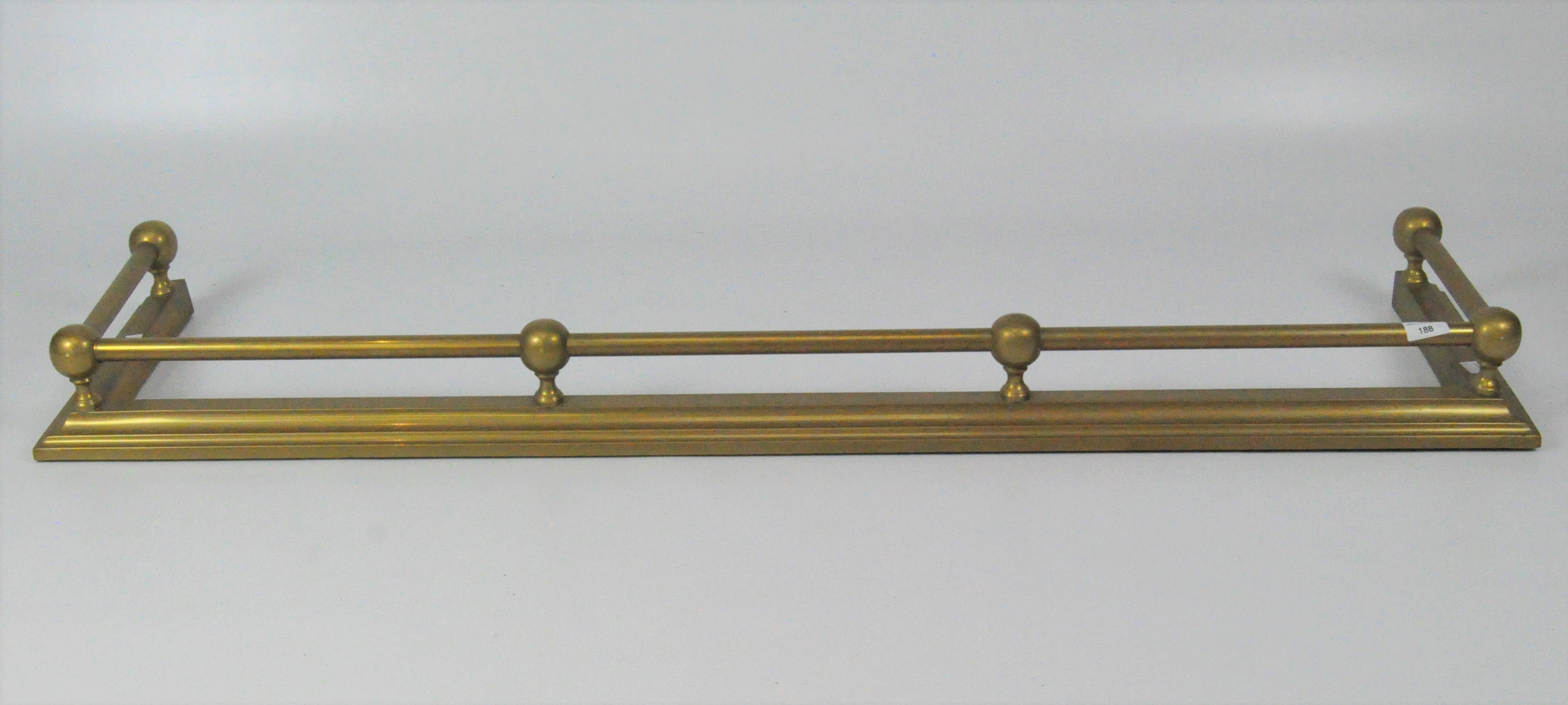 A yellow metal fire fender with contiunous railing,