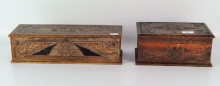 Two 20th century carved wooden boxes, one being a candle box, both with highly carved decoration,