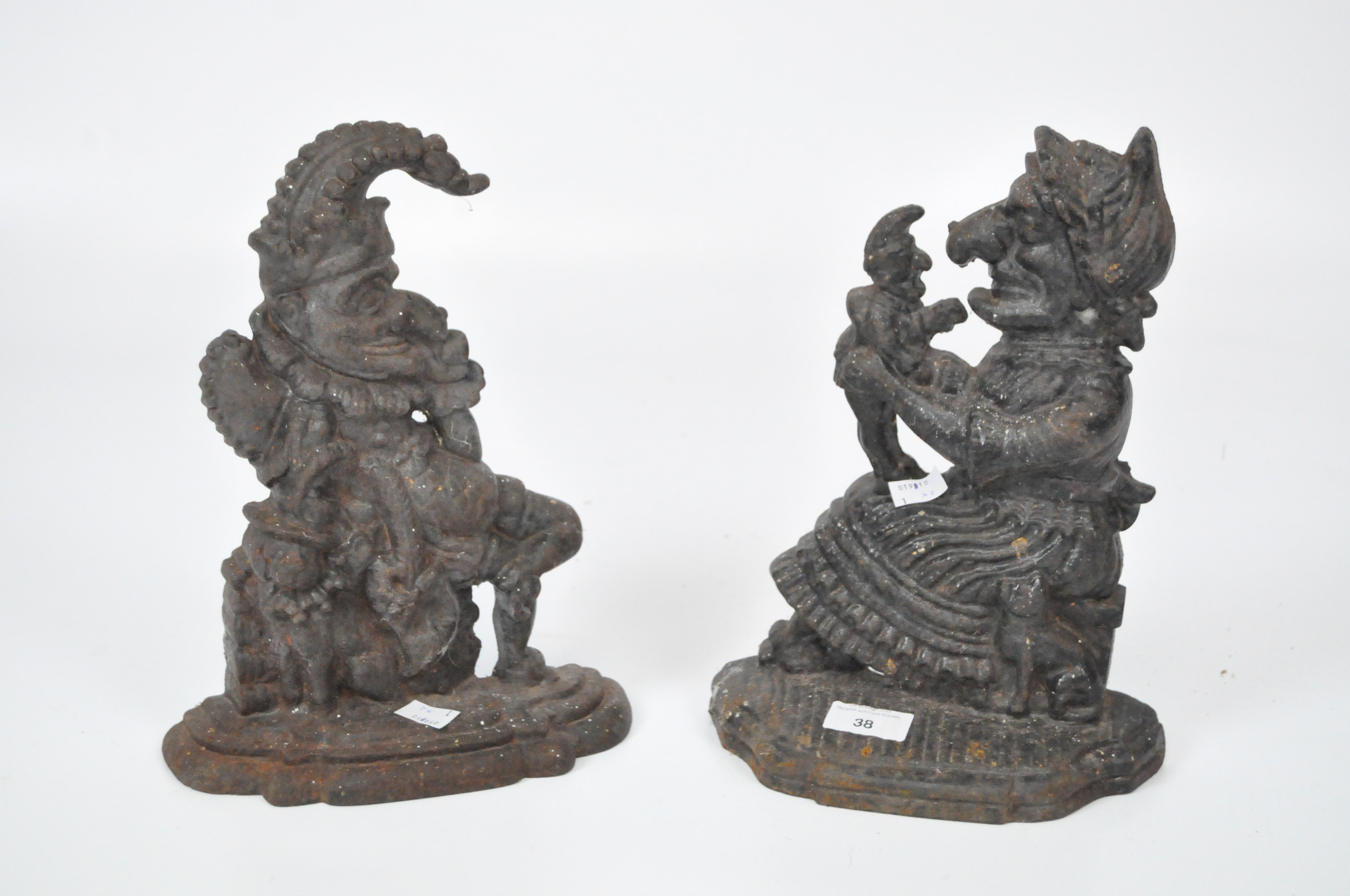 A pair of cast metal Punch and Judy door stops,