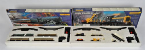 Two Hornby electric train sets, a 'Diesel Breakdown' and a 'Flying Scotsman',