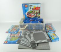 A large quantity of vintage Lego, including bricks of assorted shapes and colours, including tracks,