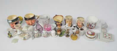 A quantity of ceramics including small Toby jugs, souvenir crested ware,