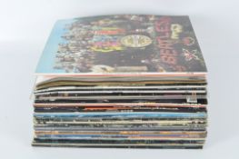 A quantity of vinyl records, including works by Blood, Sweat and Tears, Blue Oyster Cult and more,