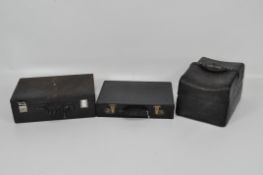 Two vintage briefcases, both leather bound, together with another bag covered in quilted leather,