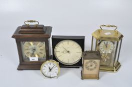 Five contemporary clocks, including an Acctin skeleton example in a brass frame,