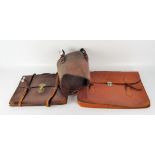 Two brown leather briefcases with metal fastenings;