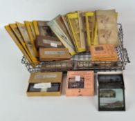 A collection of boxed sets of magic lantern slides stereo view photographs and Stereoscopic glass