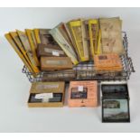 A collection of boxed sets of magic lantern slides stereo view photographs and Stereoscopic glass