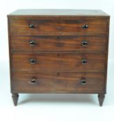 An Edwardian mahogany chest of drawers with four drawers with modern black handles, on spindle feet,