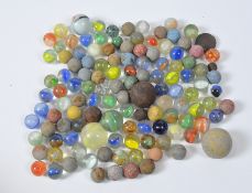 A collection of assorted matt and translucent marbles of various sizes and colours