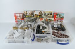 A large quantity of Airfix model kits and vehicles, including tanks, command posts,