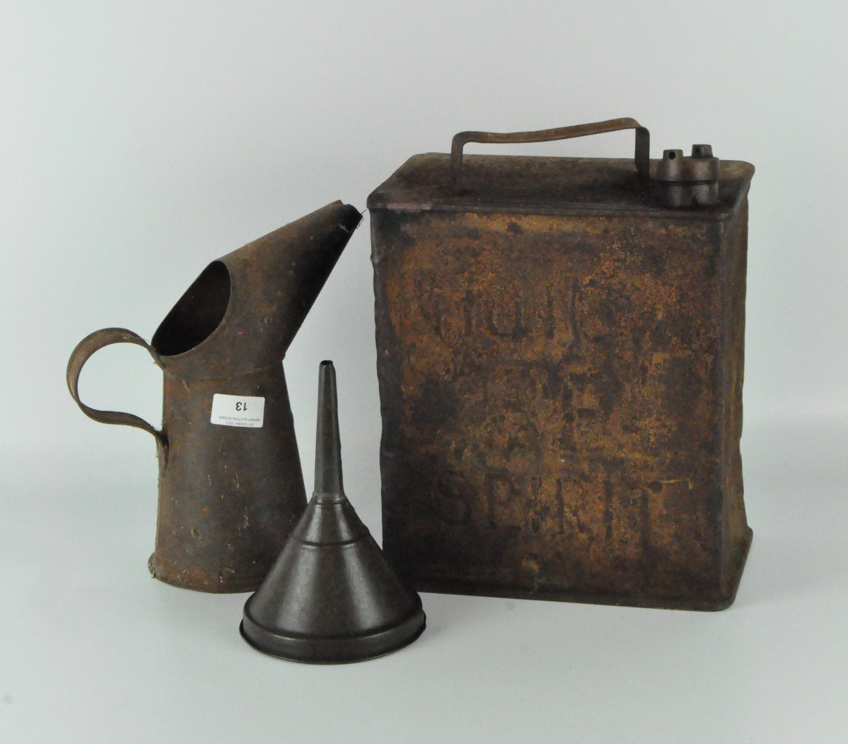 An early metal petrol can together with metal oil jug and funnel