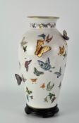 A contemporary Franklin Mint vase, titled "The Vase of a Hundred Butterflies" by Mei-lin Li,