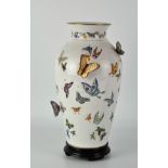 A contemporary Franklin Mint vase, titled "The Vase of a Hundred Butterflies" by Mei-lin Li,