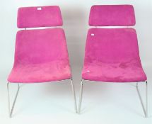 A pair of contemporary Elite Escape Lounger stackable chairs with head rest all upholstered in a