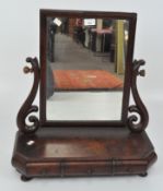 A late 19th century mahogany dressing table mirror, the mirror with scrolling supports,