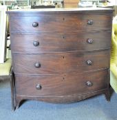 A Victorian mahogany bow front chest of four graduated drawers with curved apron