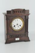 A 20th century mantel clock, white dial with Roman numerals,