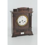 A 20th century mantel clock, white dial with Roman numerals,