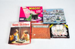 Assorted toys and games including a striped Draughts game, building block City Police boxed set,