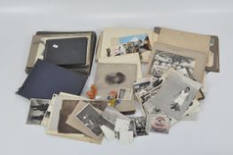 A large selection of vintage photograph albums and loose photos,