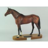 A Beswick model of 'Racehorse', standing on a wooden plinth with plaque,