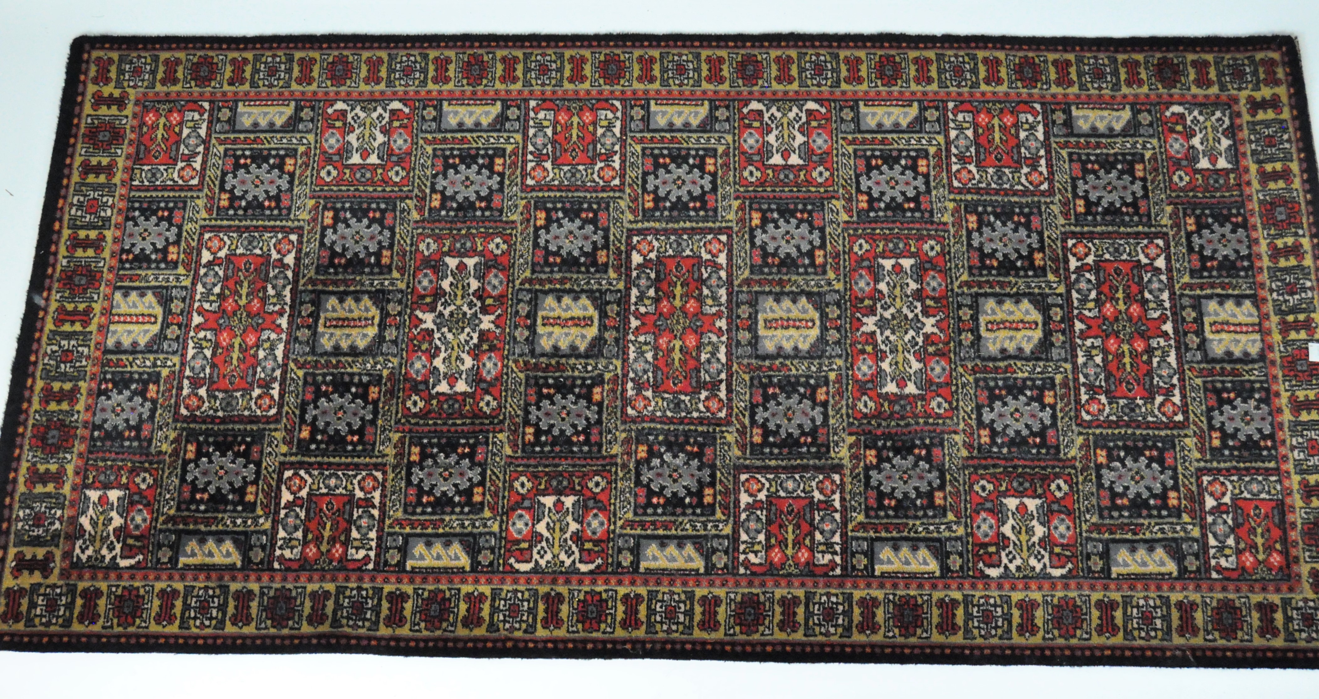 A 20th century floor rug, geometric patterns,