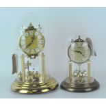 Two contemporary skeleton clocks, metal dials with Roman numerals and gilt frames