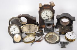 An assortment of Victorian and later mantel clock parts, including wooden and slate bodies,