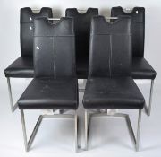 A set of five contemporary chairs, in simulated black leather upholstery with metal frames,